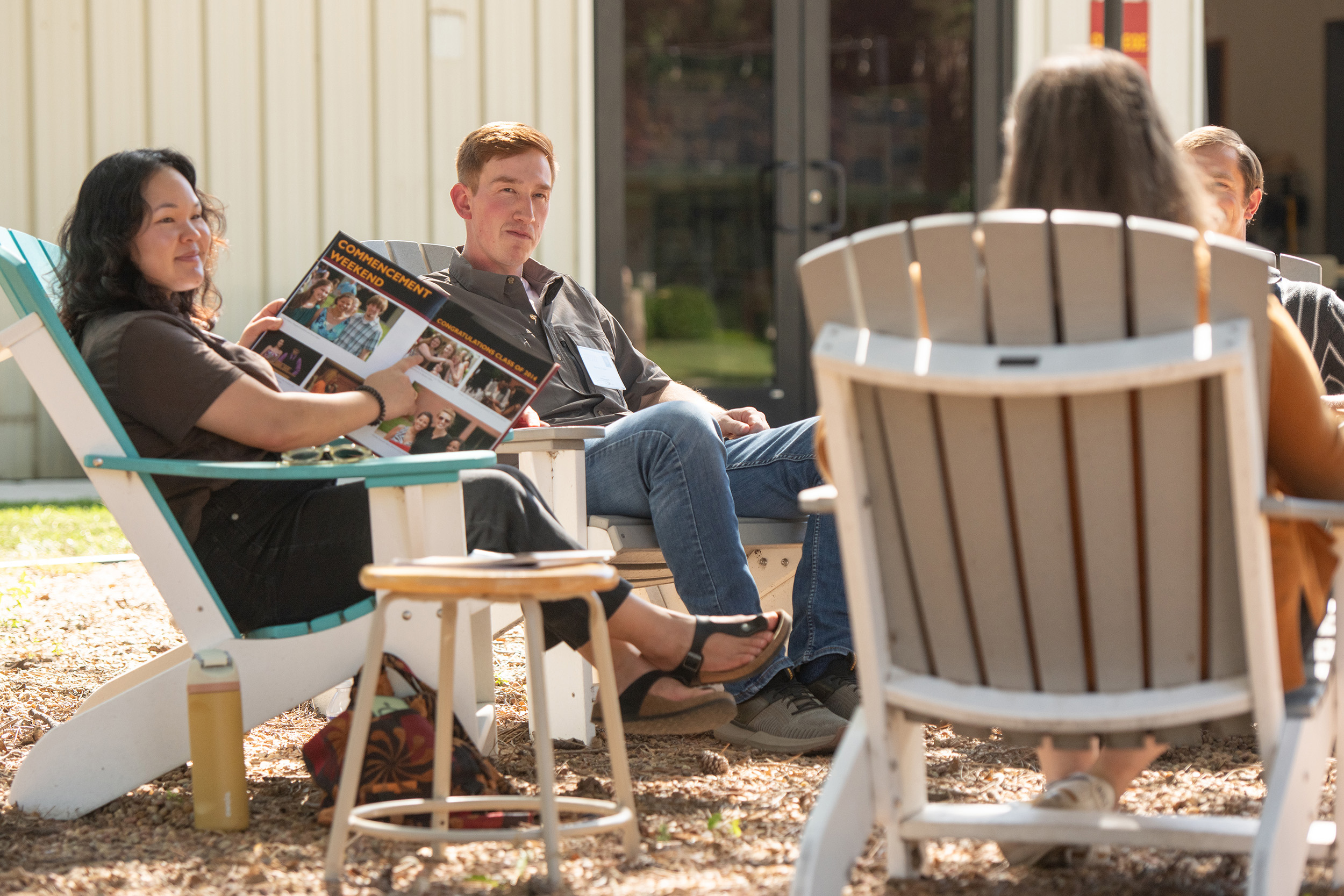 Small group of people in lounge chairs.