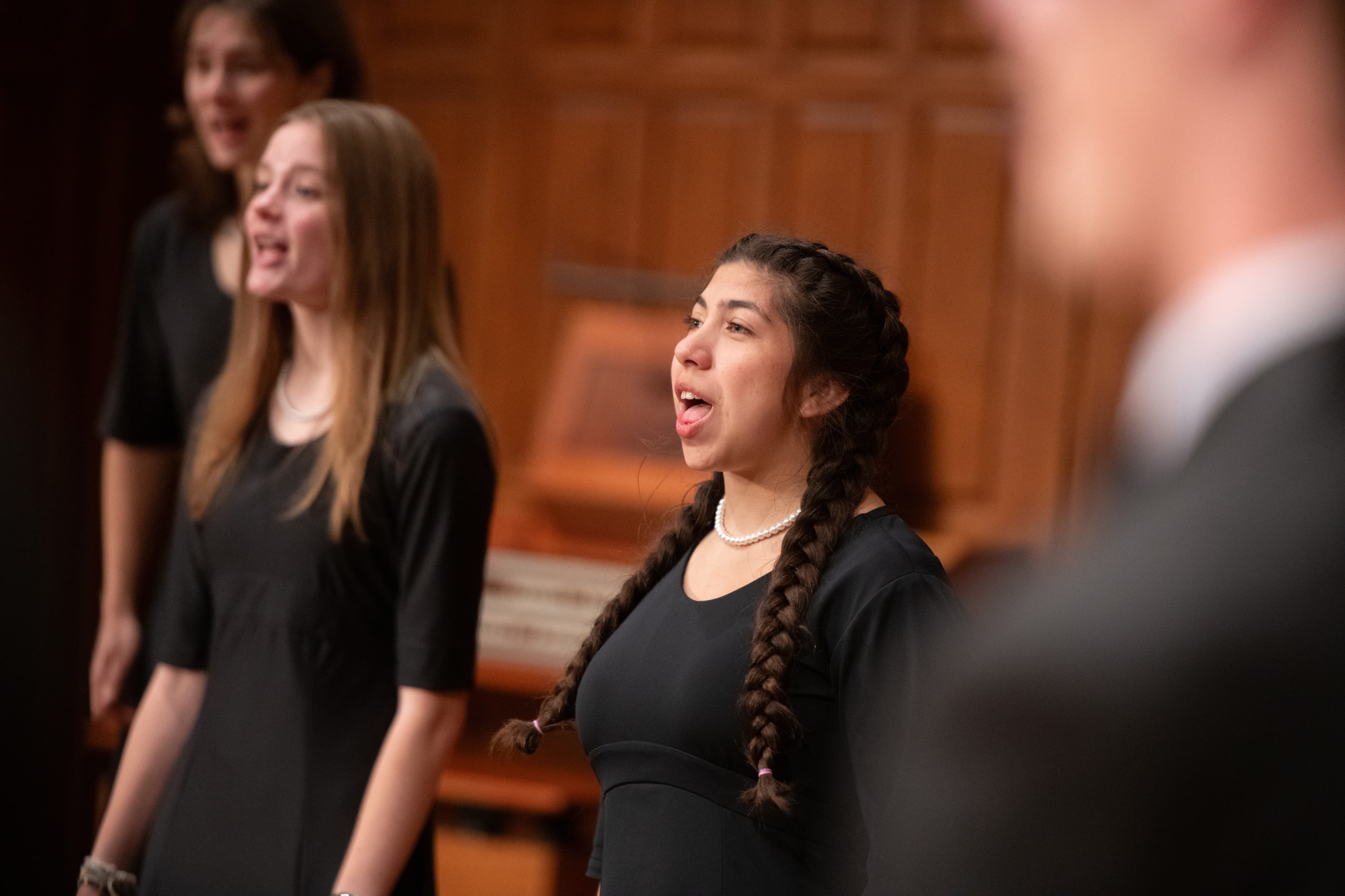 Close up of female singer mid performance.
