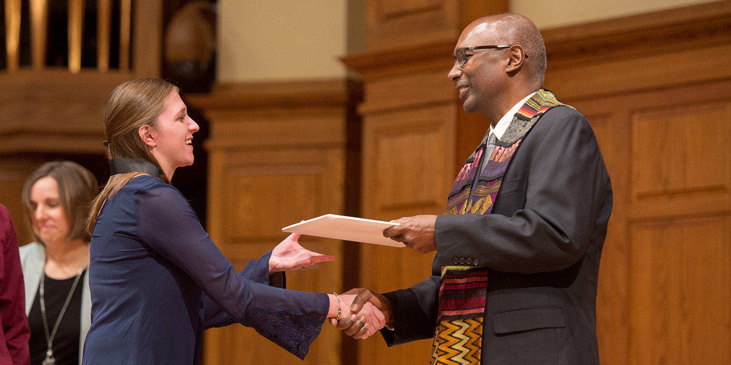 photo - Robin (Morris) Slabach receives her BSN degree from President Joseph A. Manickam during a Dec. 13, 2018, RN to BSN pinning ceremony and graduation.