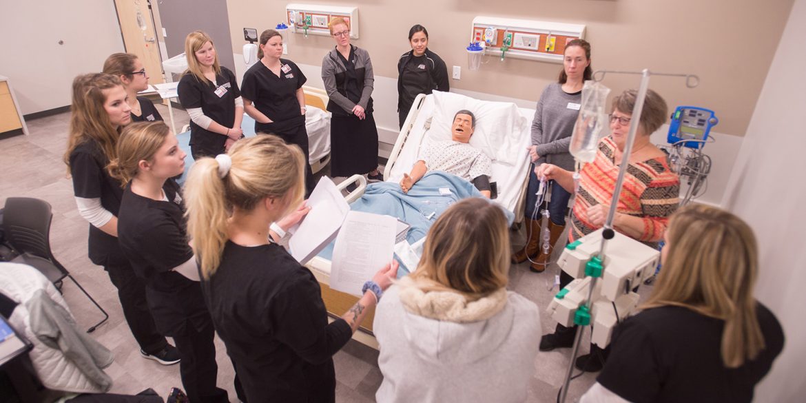 Photo: Nursing students participate in a simulation lab on the Hesston College campus.