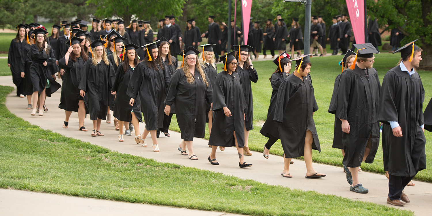 photo - graduates process to Yost Center for commencement 2018