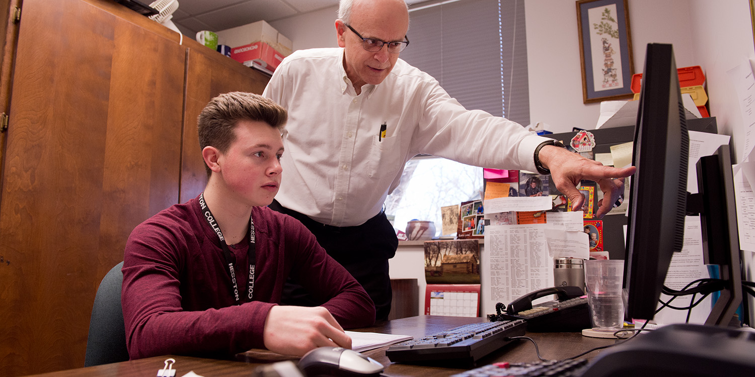 photo - Sophomore Cal Hartley works with Business Manager Karl Brubaker in Hartley's internship.