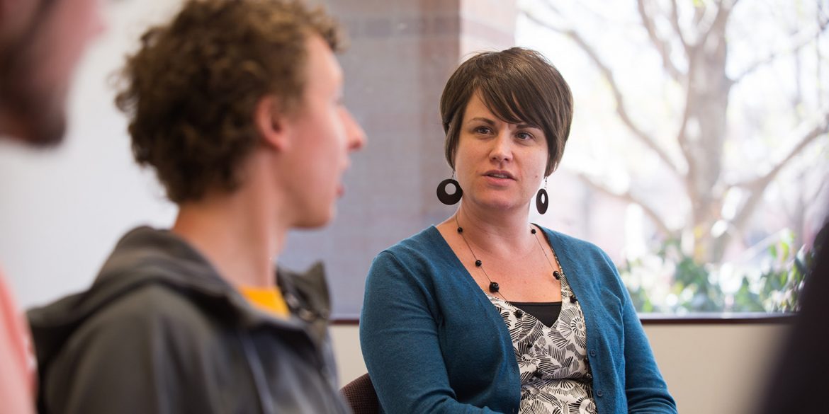 Photo: Kendra Burkey advises the Hesston College Horizon staff.