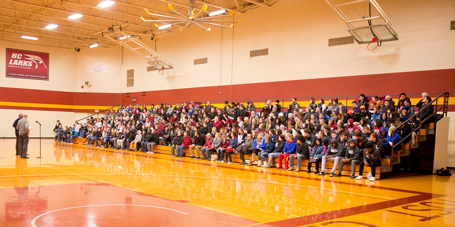 A crowd of students, faculty and staff listens to a Martin Luther King Jr Day presentation at Hesston College