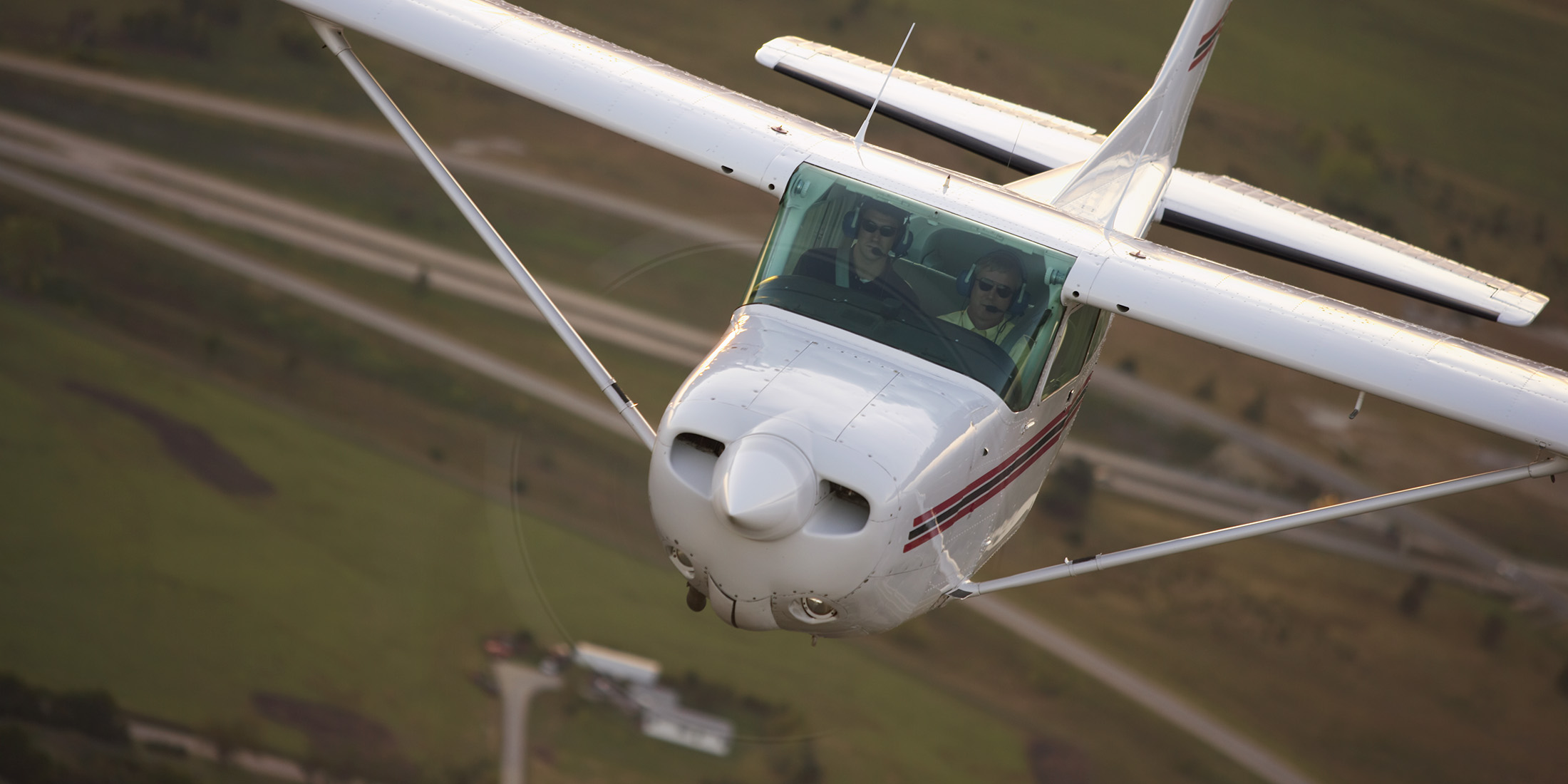 A Cessna 172RG from Hesston College's fleet in flight