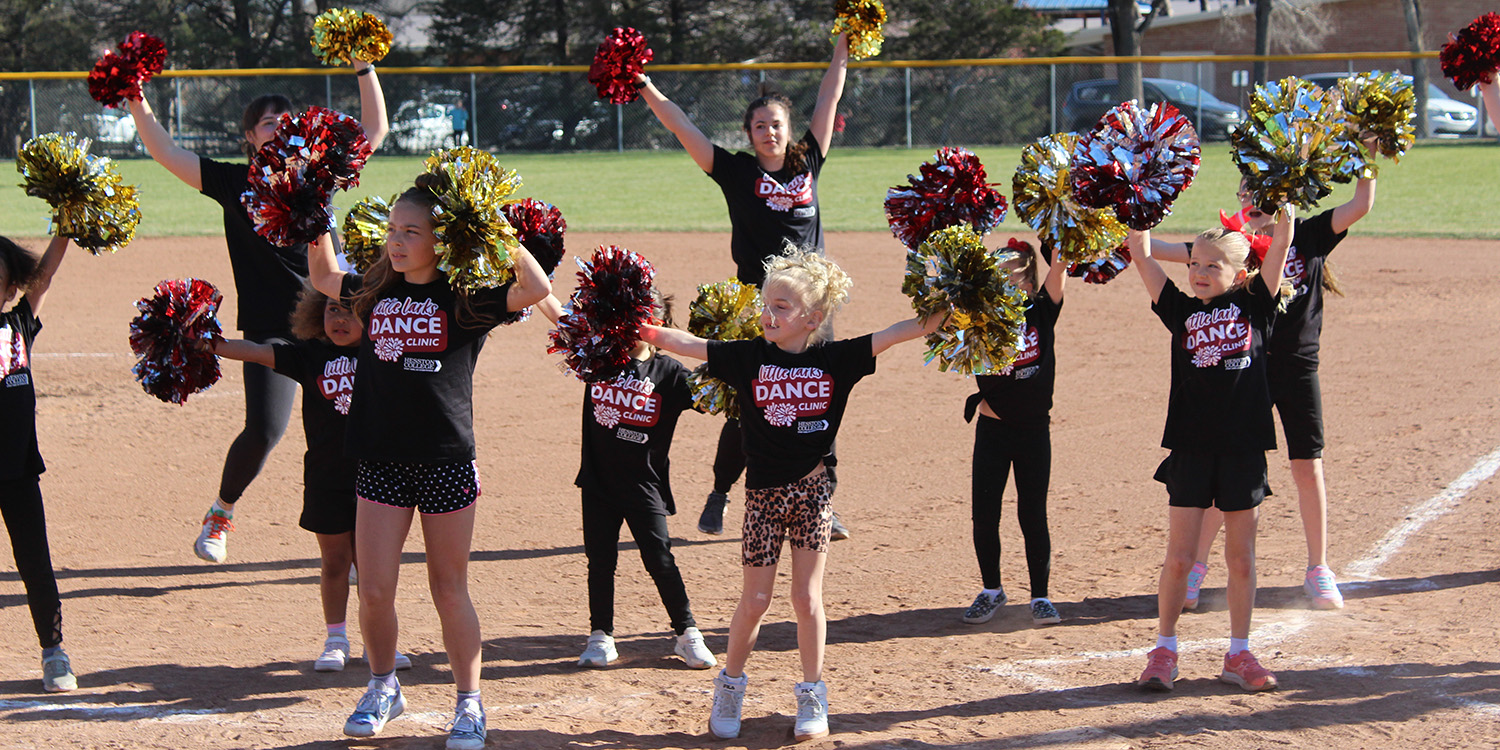 Community Days dance clinic performance on the baseball field