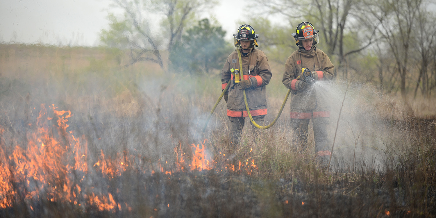 photo - Hesston College EMS-fire students assist with a controlled burn