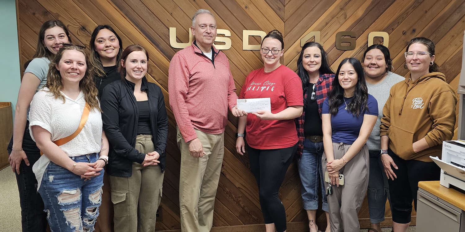 Group of nursing students with donation check.