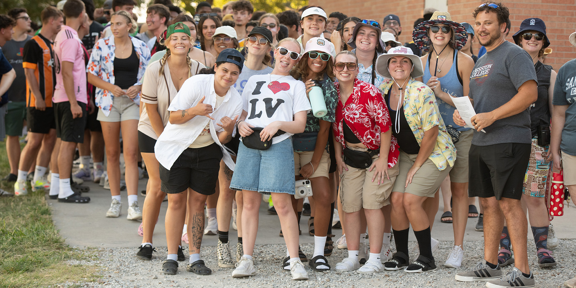 Students posing dressed as tourists.