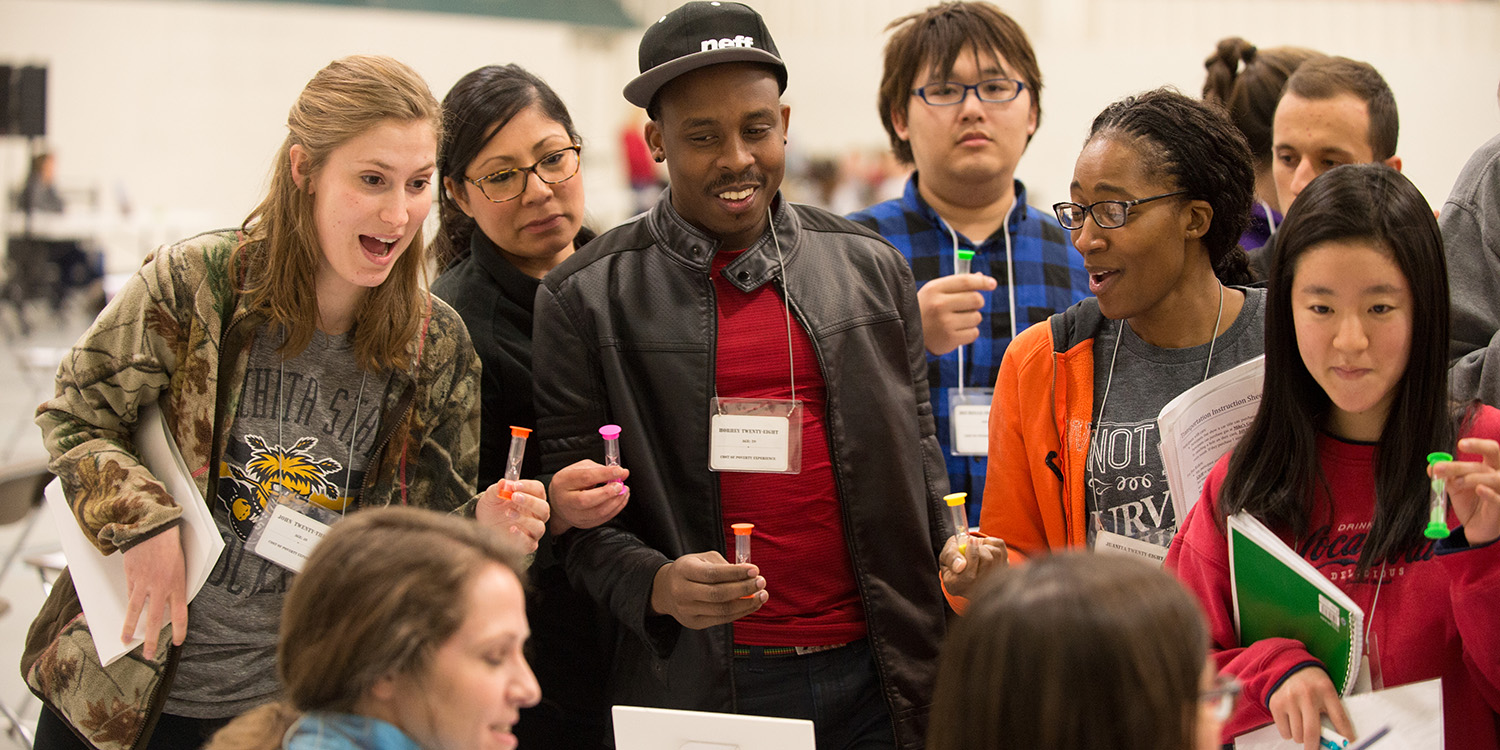 photo - students participating in a poverty simulation